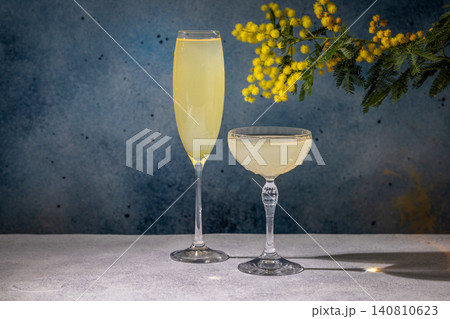Mimosa cocktails with garnish celebrating spring season 140810623