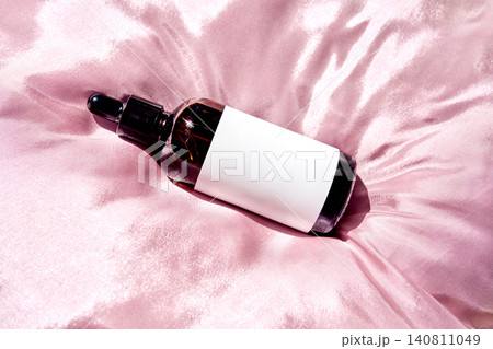 Skincare trends biotech serum dropper bottle on silk Skincare trends biotech serum dropper bottle on silk 140811049