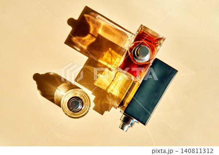 Perfume bottles creating sunlit shadows beauty trends Perfume bottles creating sunlit shadows beauty trends 140811312