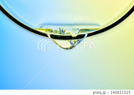 Advanced skincare serum droplet applying to glass surface Advanced skincare serum droplet applying to glass surface 140811525