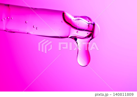 Peptide serum dropping from pipette for advanced skincare 140811809