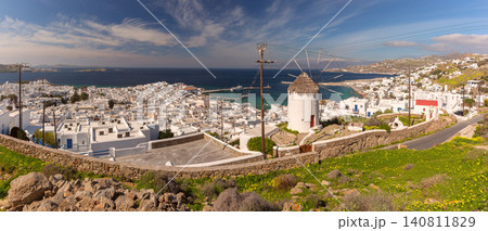 Traditional windmill overlooking Mykonos Town and harbor on Mykonos Island, Greece Traditional windmill overlooking Mykonos Town and harbor on Mykonos Island, Greece 140811829