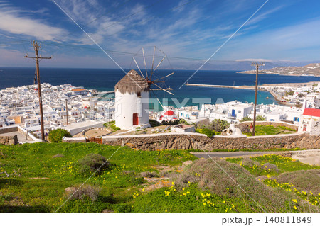 Traditional windmill overlooking Mykonos Town and harbor on Mykonos Island, Greece Traditional windmill overlooking Mykonos Town and harbor on Mykonos Island, Greece 140811849