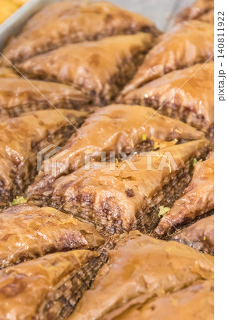 Turkisch baklava. Sweet pastry made of layers filo dough with chocolate and honey Turkisch baklava. Sweet pastry made of layers filo dough with chocolate and honey 140811922