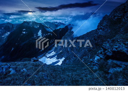 romania mountain landscape in summer at night. full moon over travel background of alpine scenery in fagaras mountain ridge. european summer outdoor adventures. mysterious fantasy romania mountain landscape in summer at night. full moon over travel background of alpine scenery in fagaras mountain ridge. european summer outdoor adventures. mysterious fantasy 140812013