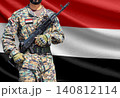Yemen flag with soldier holding assault rifle 140812114