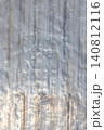 Weathered aluminum sheet texture in outdoor industrial setting 140812116