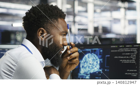 Programmer uses neural network node tree software to analyze infrastructure in a data center. 140812947