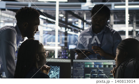 Data center colleagues use node tree software together to analyze datasets and optimize system health. 140813014