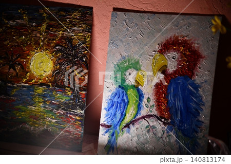 Artist Works on Abstract Oil Painting, Moving Paint Brush Energetically She Creates Modern Masterpiece. Dark Creative Studio where Large Canvas Stands on Easel Illuminated. Low Angle Artist Works on Abstract Oil Painting, Moving Paint Brush Energetically She Creates Modern Masterpiece. Dark Creative Studio where Large Canvas Stands on Easel Illuminated. Low Angle 140813174