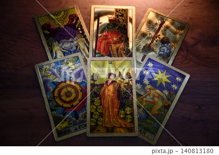 Hand holding tarot card with candlelight on the darkness background for Astrology Occult Magic illustration - Magic Hand holding tarot card with candlelight on the darkness background for Astrology Occult Magic illustration - Magic 140813180