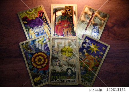 Hand holding tarot card with candlelight on the darkness background for Astrology Occult Magic illustration - Magic Hand holding tarot card with candlelight on the darkness background for Astrology Occult Magic illustration - Magic 140813181