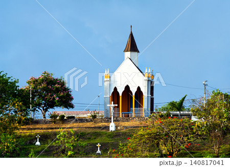 The historic Chapelle du Calvaire stands on a grassy hill under a clear blue sky in Fort-de-France, Martinique. The historic Chapelle du Calvaire stands on a grassy hill under a clear blue sky in Fort-de-France, Martinique. 140817041