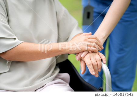 Close up nurse holding hand senior patient for encourage, assistance and support. Close up nurse holding hand senior patient for encourage, assistance and support. 140817542