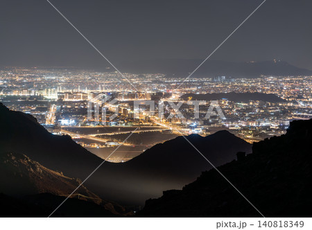 A wide panoramic view of the illuminated city of Madinah at night seen from the Jabal Uhud viewpoint in Saudi Arabia A wide panoramic view of the illuminated city of Madinah at night seen from the Jabal Uhud viewpoint in Saudi Arabia 140818349