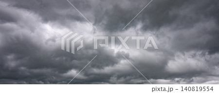 Gray storm clouds moving overhead in dramatic sky Gray storm clouds moving overhead in dramatic sky 140819554