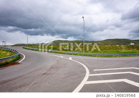 Winding road curves through open landscape 140819568