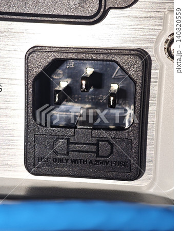 Computer power inlet connector with fuse holder on metal panel, close up Computer power inlet connector with fuse holder on metal panel, close up 140820559