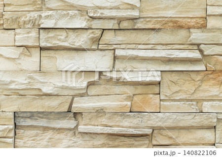 Natural stone wall texture stacked beige rock pattern creating durable architectural surface for construction interior exterior decoration design background Natural stone wall texture stacked beige rock pattern creating durable architectural surface for construction interior exterior decoration design background 140822106