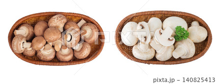 Brown and white champignon mushroom a wicker basket isolated on white background. Top view. Flat lay Brown and white champignon mushroom a wicker basket isolated on white background. Top view. Flat lay 140825413