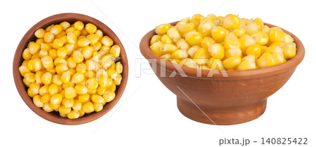 corn seeds in ceramic bowl isolated on white background. Top view. Flat lay corn seeds in ceramic bowl isolated on white background. Top view. Flat lay 140825422