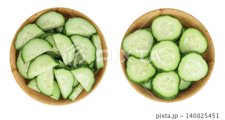 Sliced cucumber in wooden bowl isolated on white background with full depth of field. Top view. Flat lay. Sliced cucumber in wooden bowl isolated on white background with full depth of field. Top view. Flat lay. 140825451