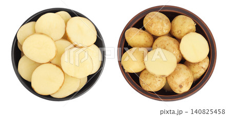 young potato slices in ceramic bowl isolated on white background. Harvest new. Top view. Flat lay. young potato slices in ceramic bowl isolated on white background. Harvest new. Top view. Flat lay. 140825458