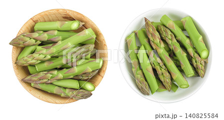 fresh asparagus in wooden bowl isolated on white background. Top view. Flat lay. fresh asparagus in wooden bowl isolated on white background. Top view. Flat lay. 140825584