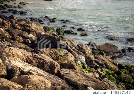 Waves crashing against the rocky coastline with a view of the Mediterranean Sea in Tel Aviv Waves crashing against the rocky coastline with a view of the Mediterranean Sea in Tel Aviv 140827149