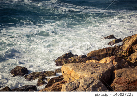Waves crashing against the rocky coastline with a view of the Mediterranean Sea in Tel Aviv Waves crashing against the rocky coastline with a view of the Mediterranean Sea in Tel Aviv 140827225