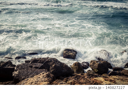 Waves crashing against the rocky coastline with a view of the Mediterranean Sea in Tel Aviv Waves crashing against the rocky coastline with a view of the Mediterranean Sea in Tel Aviv 140827227