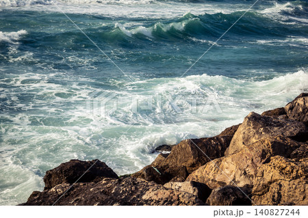 Waves crashing against the rocky coastline with a view of the Mediterranean Sea in Tel Aviv Waves crashing against the rocky coastline with a view of the Mediterranean Sea in Tel Aviv 140827244