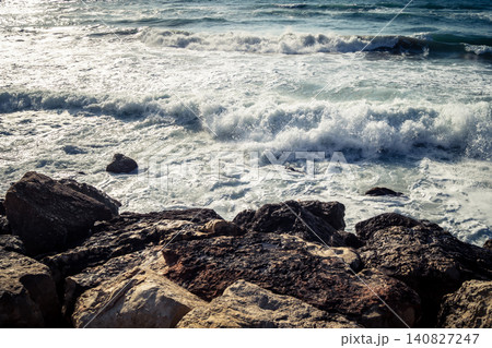 Waves crashing against the rocky coastline with a view of the Mediterranean Sea in Tel Aviv Waves crashing against the rocky coastline with a view of the Mediterranean Sea in Tel Aviv 140827247
