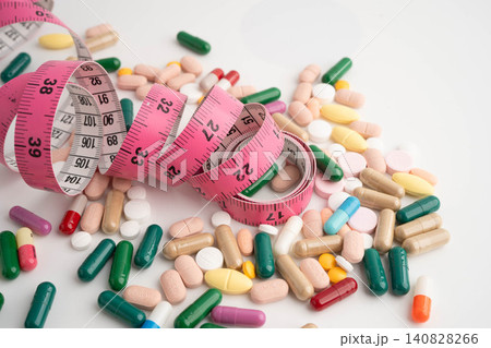 Measuring tape and tablet drug medical for diet. 140828266