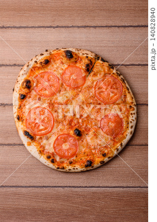 Italian pizza margherita with cheese, tomatoes, and tomato sauce, fast food. Pizza margherita 140828940