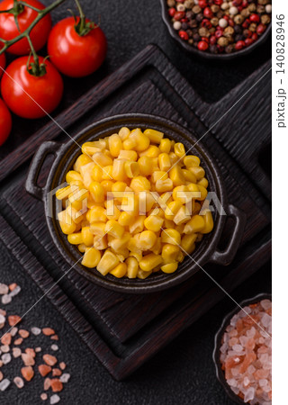 Golden, sweet canned corn kernels or maize for salads and vegetarian dishes. Canned corn Golden, sweet canned corn kernels or maize for salads and vegetarian dishes. Canned corn 140828946