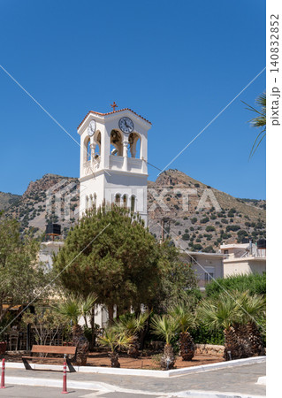 Vertical shot of the white clock tower and belfry of the Orthodox Church of Saints Constantine and Helena in Elounda, Crete, Greece Vertical shot of the white clock tower and belfry of the Orthodox Church of Saints Constantine and Helena in Elounda, Crete, Greece 140832852