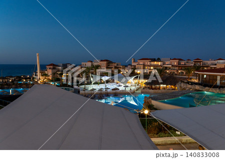 Luxury sea resort with illuminated swimming pools at twilight Luxury sea resort with illuminated swimming pools at twilight 140833008