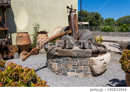 Ancient traditional stone olive oil press and milling mechanism 140833044