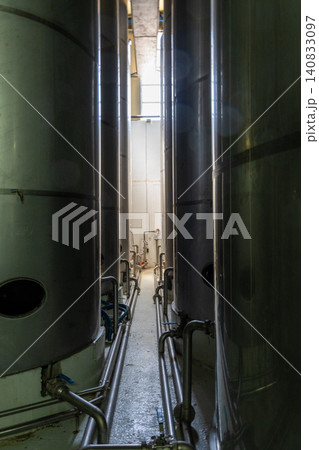 Stainless steel storage tanks inside olive oil factory on Crete Stainless steel storage tanks inside olive oil factory on Crete 140833097