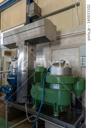 Industrial centrifuge separator machine in olive oil extraction factory Industrial centrifuge separator machine in olive oil extraction factory 140833102