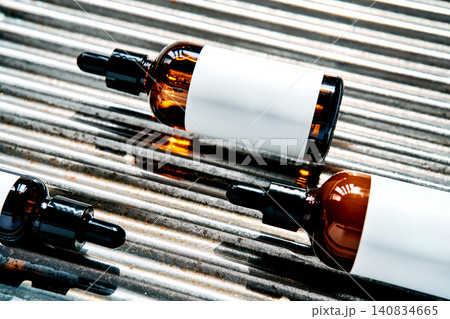 Skincare droppers presenting serum bottles on corrugated metal Skincare droppers presenting serum bottles on corrugated metal 140834665