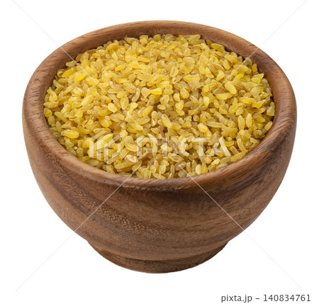 Bulgur wheat grains in wooden bowl isolated on white background with clipping path Bulgur wheat grains in wooden bowl isolated on white background with clipping path 140834761