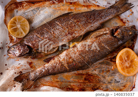 baked fish on a baking sheet, with spices and herbs, daylight, homemade, no people, baked fish on a baking sheet, with spices and herbs, daylight, homemade, no people, 140835037