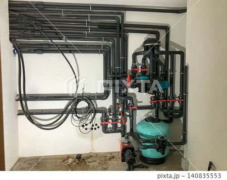 Swimming pool water filtration system piping and pump equipment Swimming pool water filtration system piping and pump equipment 140835553