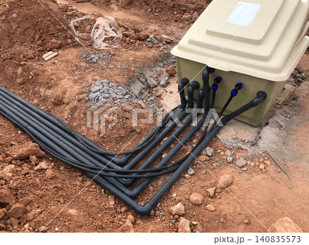 Geothermal heat pump connection pipes installed in soil Geothermal heat pump connection pipes installed in soil 140835573