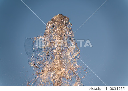 Splashes and jets of water against light background. Splashes and jets of water against light background. 140835955