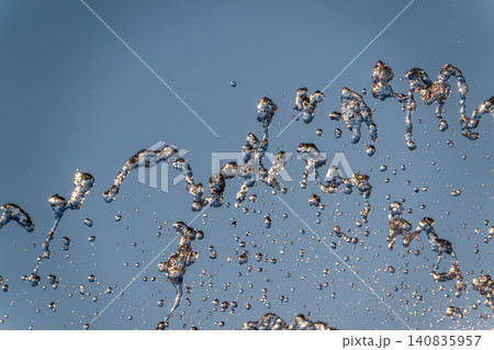 Splashes and jets of water against light background. 140835957