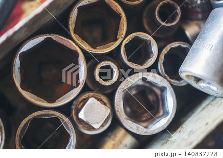 Mechanic tools engineering equipment car auto repair shop with copy space. Blurred background mechanical service. Heavy screw grungy rusted wrenches dirty screwdriver object. Industrial hardware set Mechanic tools engineering equipment car auto repair shop with copy space. Blurred background mechanical service. Heavy screw grungy rusted wrenches dirty screwdriver object. Industrial hardware set 140837228