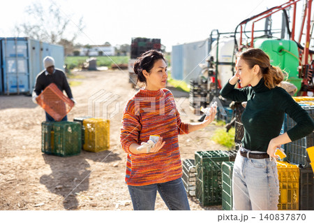 Quarrel between two women in the backyard of farm after work Quarrel between two women in the backyard of farm after work 140837870